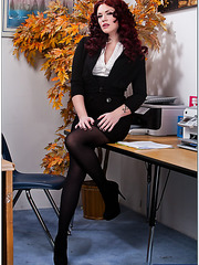 Elegant redhead babe Andy San Dimas sucks a cock in the office
